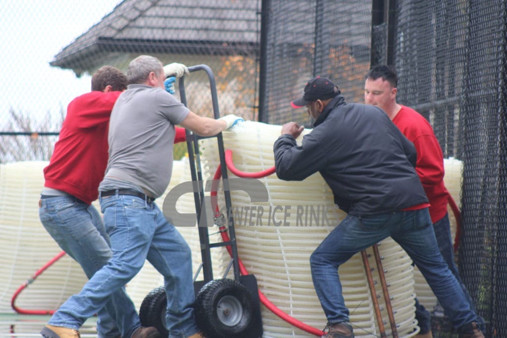 Workers installing a rink